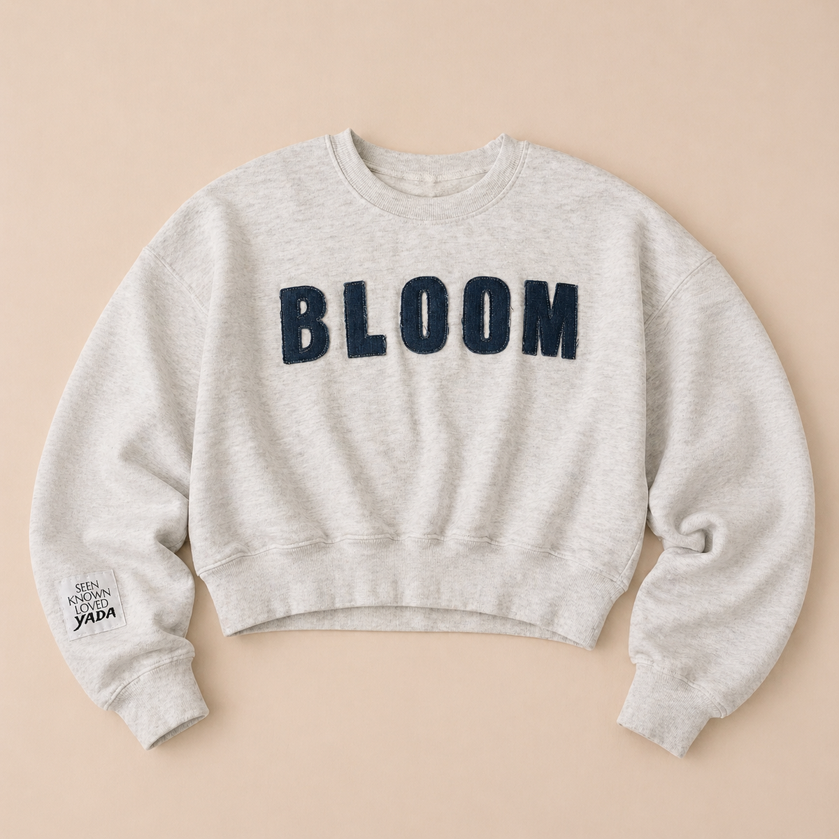 Bloom sweatshirt with repurposed denim lettering from Yada Made