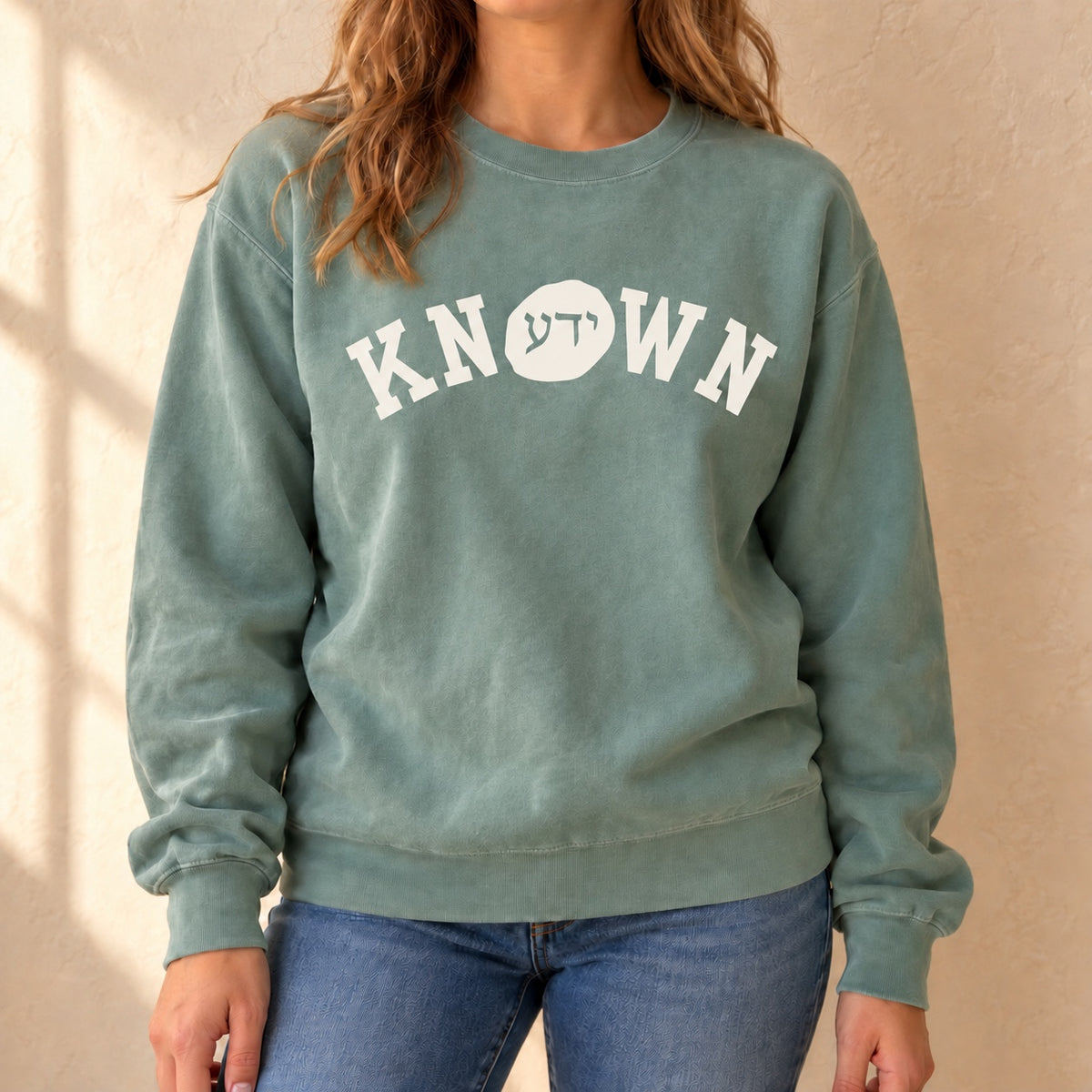 Known green sweatshirt worn by a model