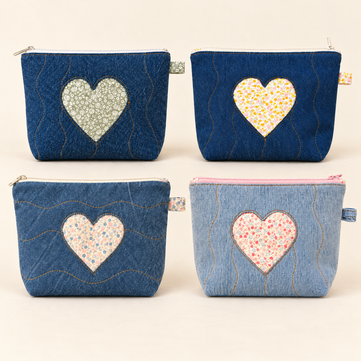 Four Loved Denim Pouches with floral heart details in assorted denim washes